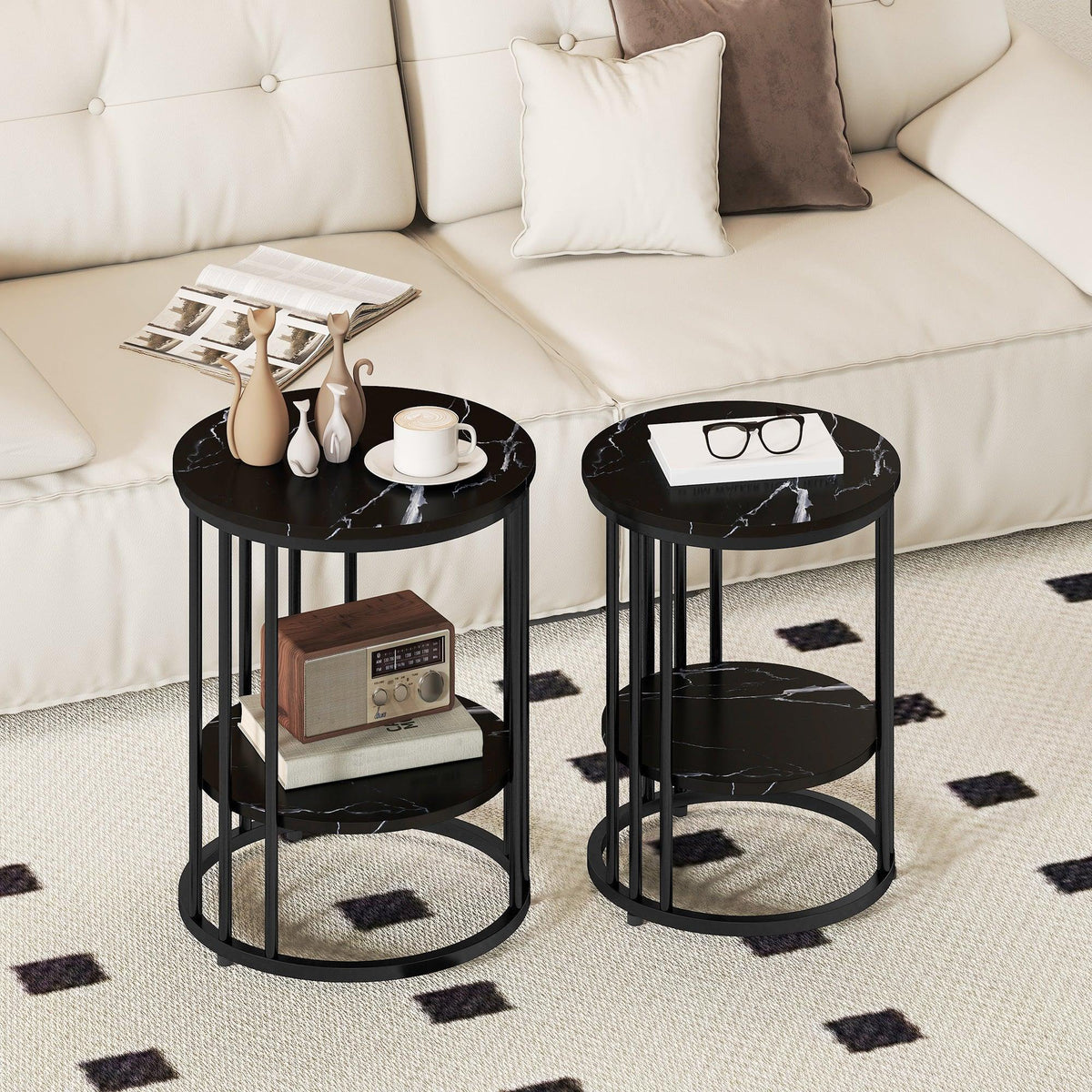 Set of two round two-tier coffee tables, faux marble tops, black steel frames