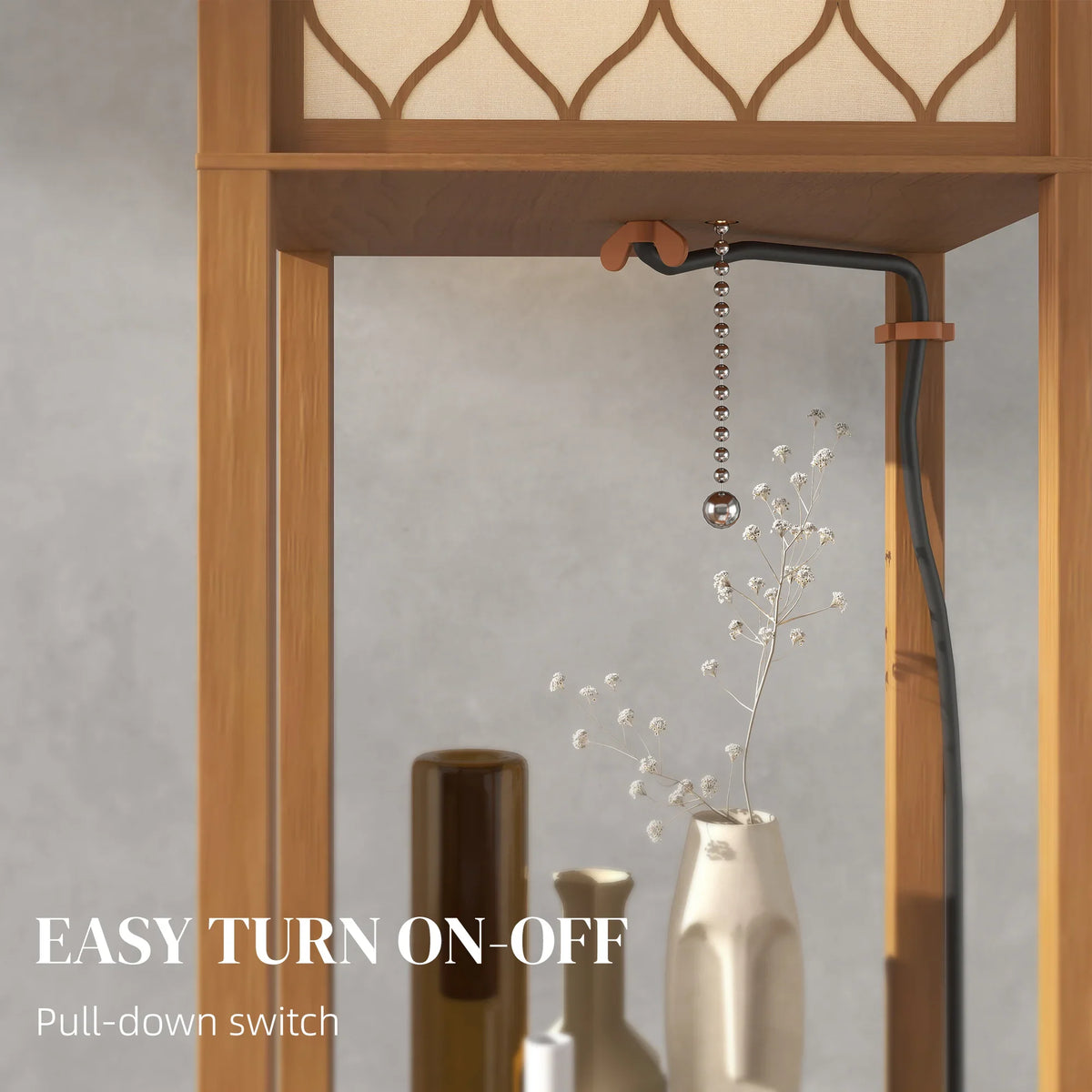 Tall narrow standing lamp with honeycomb shade, pull-down switch, natural wood shelves.