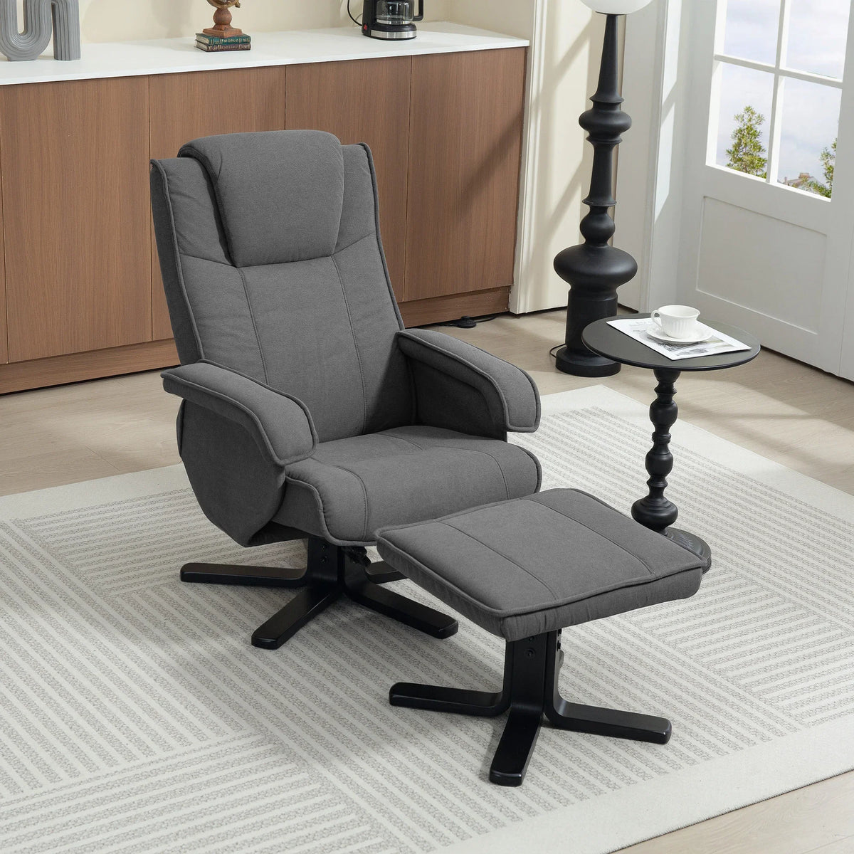 Charcoal grey velvet swivel recliner chair with footstool extended
