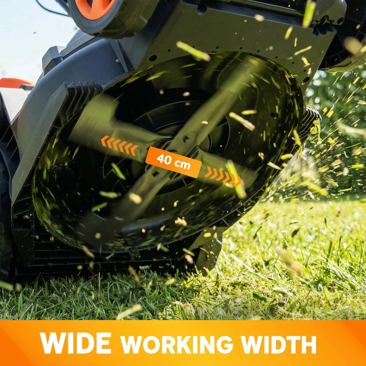 40 cm cutting blade with flying grass clippings inside electric lawn mower deck