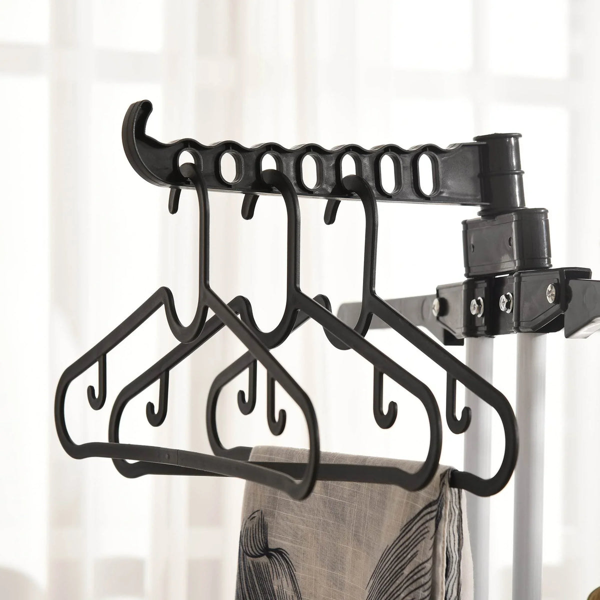 Black clothes drying rack hanger bar with multiple curved hooks