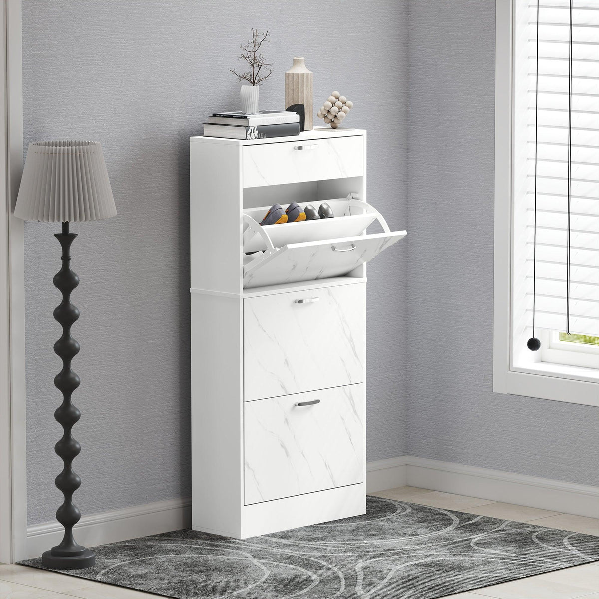 White shoe cabinet with open top flip drawer and two lower flip drawers, marble-look finish