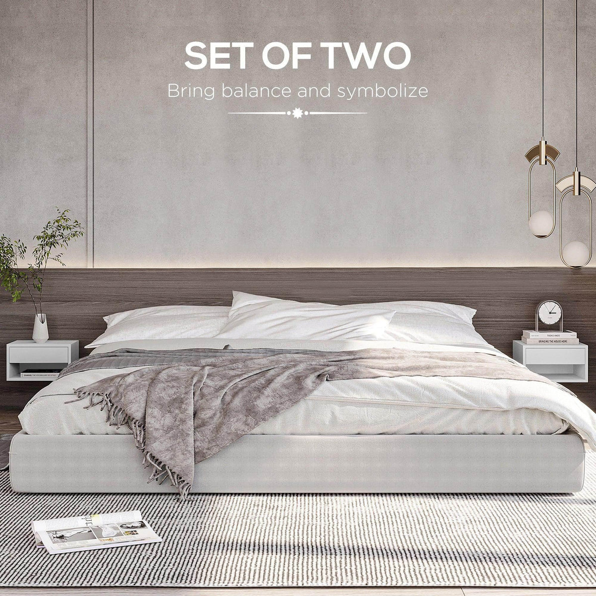 White low bedside table with drawer and open shelf beside a bed
