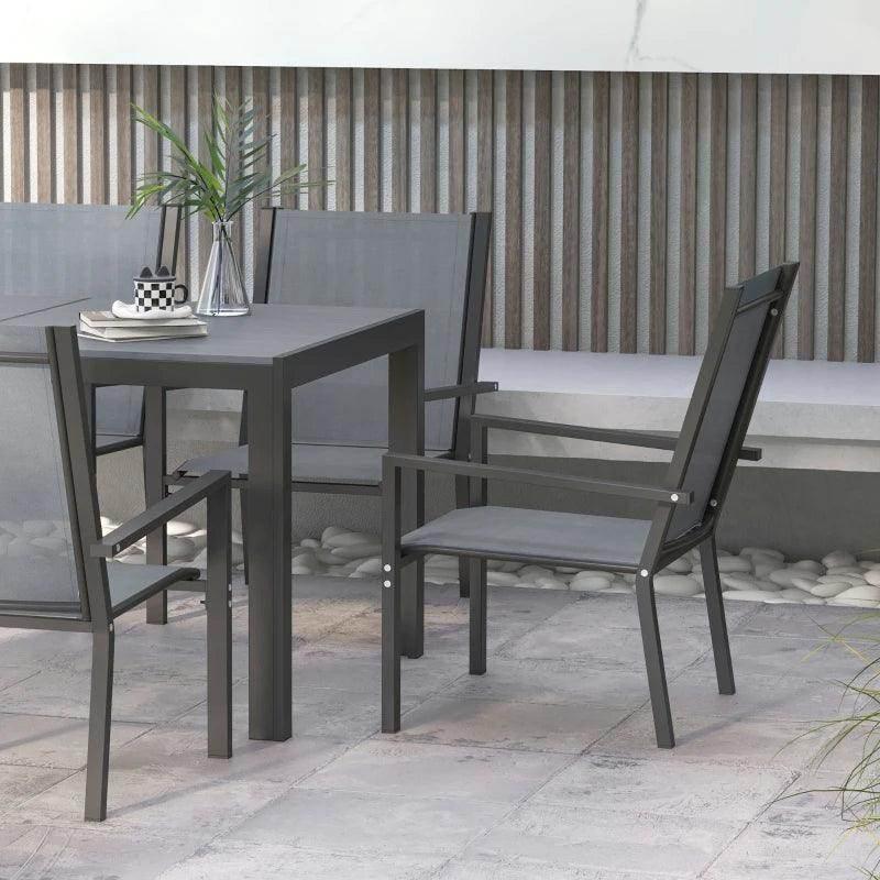 Light grey dining set with square table and armchairs arranged on patio