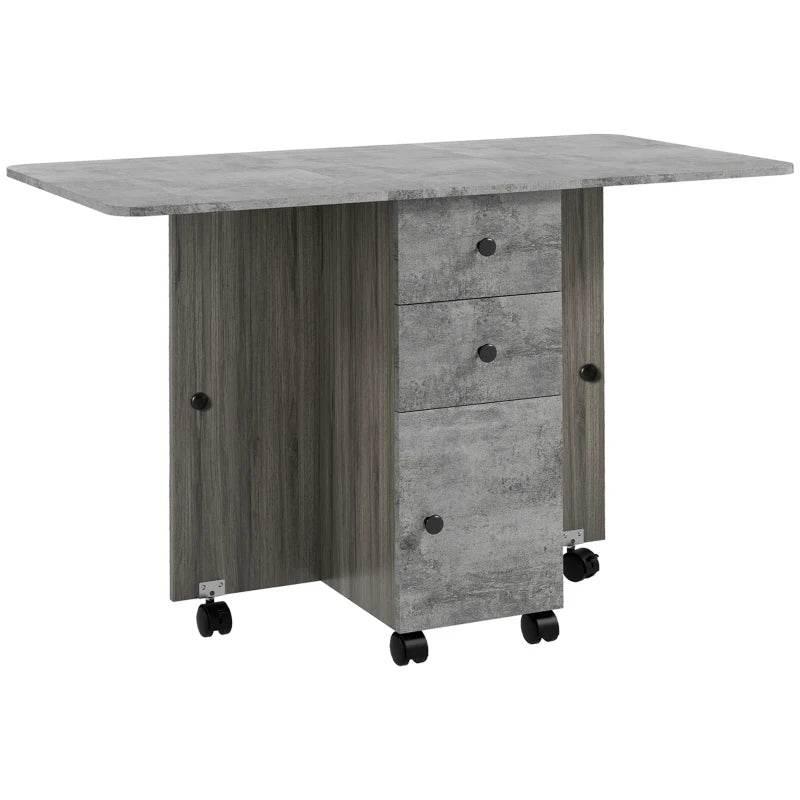 Foldable dining table with drop-leaf top, grey woodgrain finish, side drawers and casters