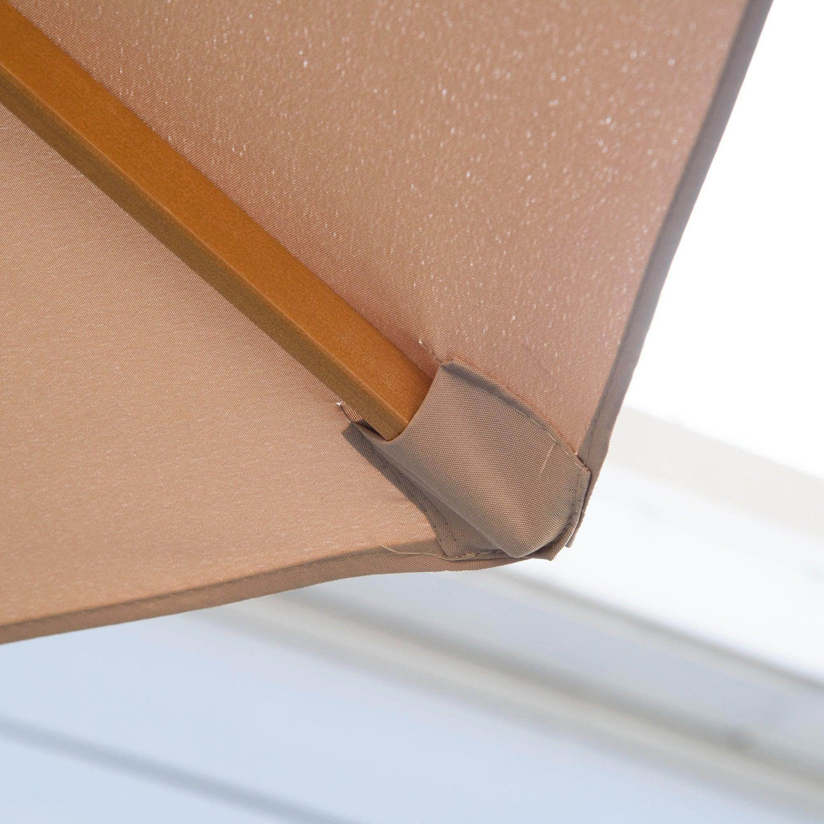 Khaki umbrella canopy corner with reinforced edge and attached tie strap
