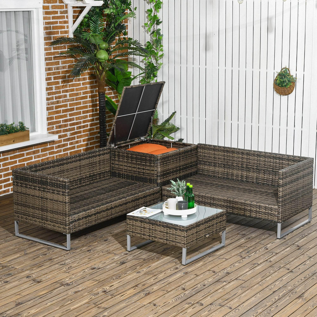 L-shaped patio rattan seating set with orange cushions and square coffee table