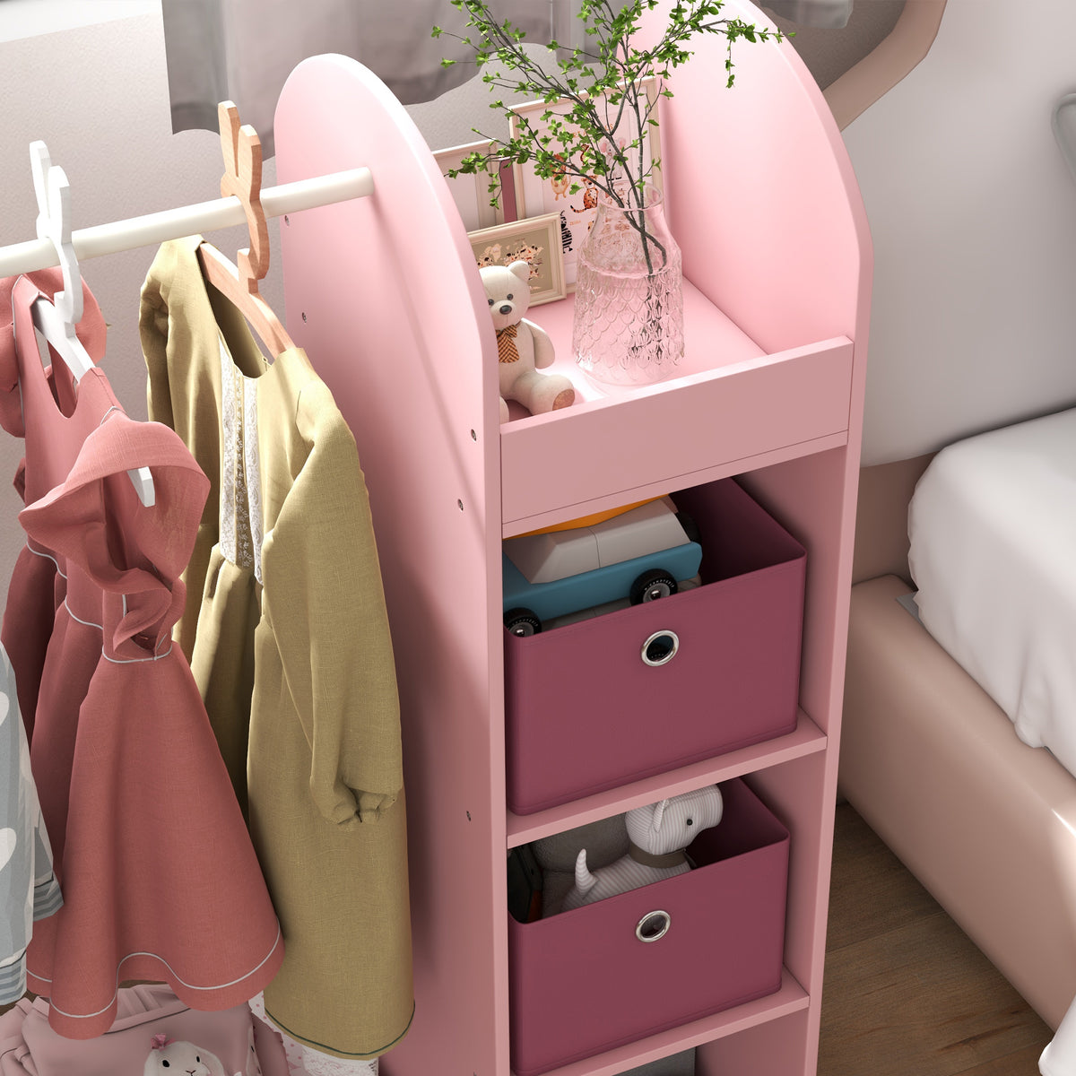 Pink kids clothing organizer with hanging rail and storage bins in side shelving