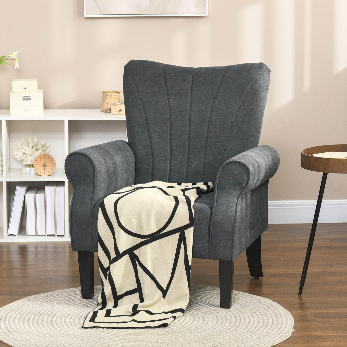 Grey high-back accent armchair with rolled arms and black wooden legs