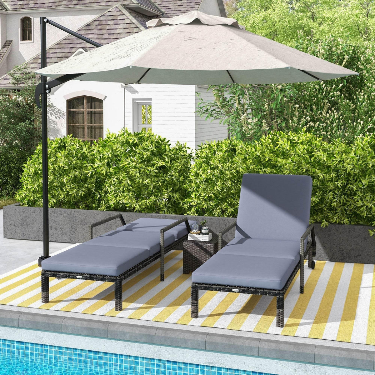 Outdoor rattan sun loungers set with dark gray frames, two cushions, adjustable backs