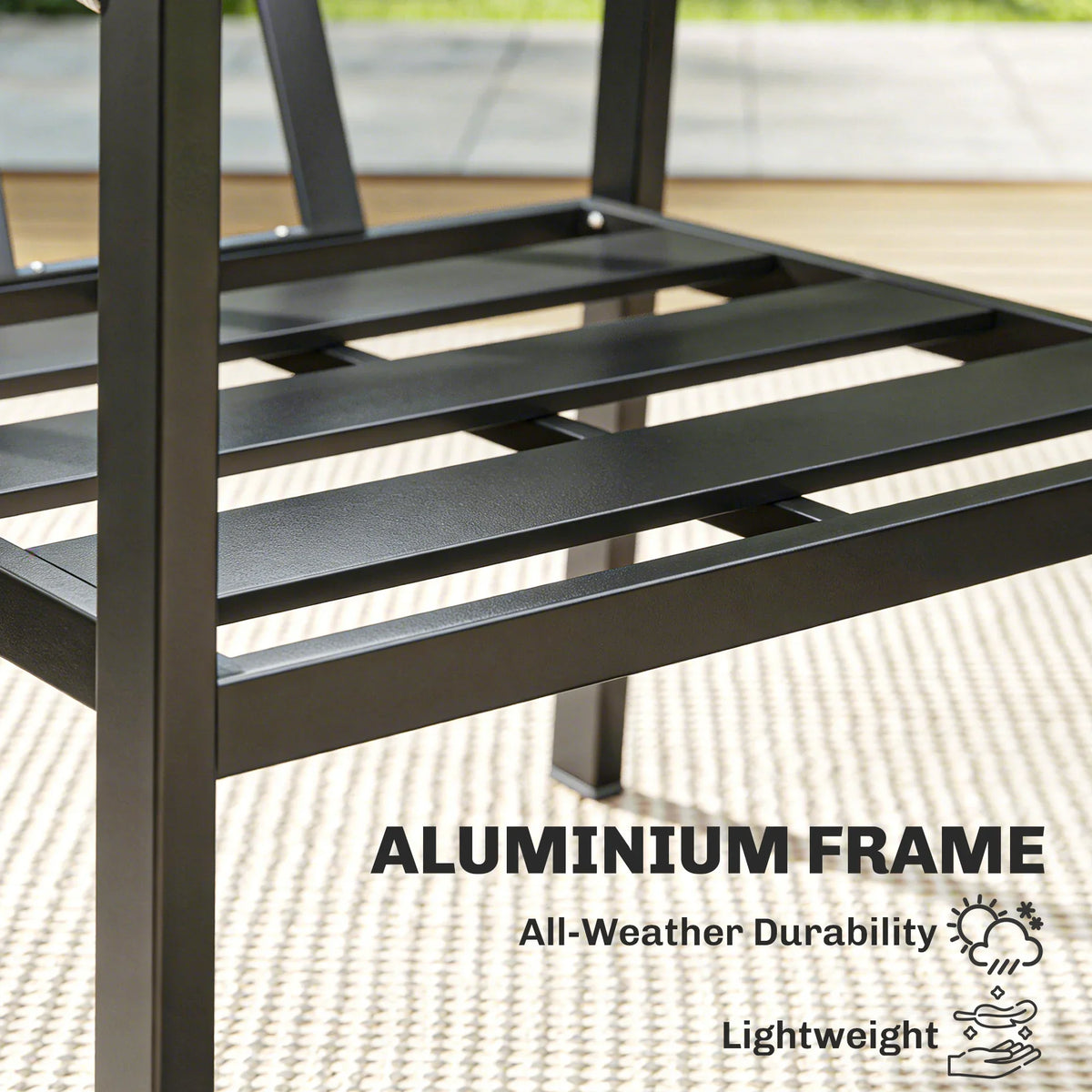 Aluminum slatted patio table with dark tabletop and sturdy frame
