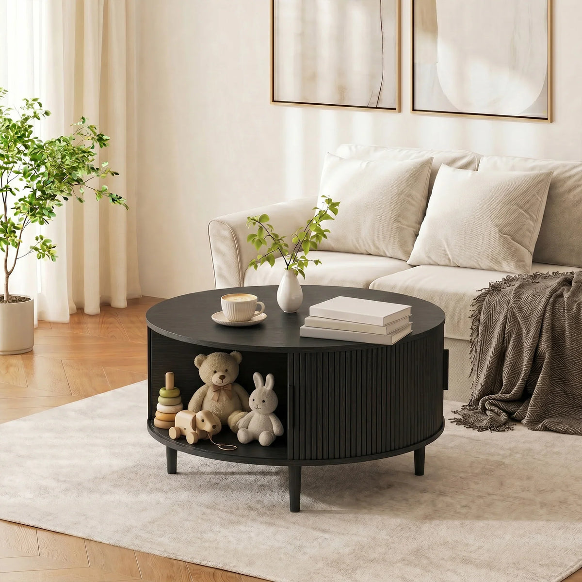 Black round coffee table with fluted side design and lift-top lid closed