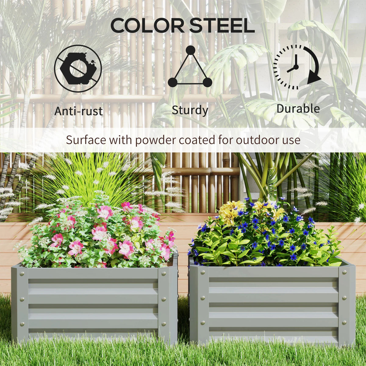 Two gray raised steel planter boxes with colorful flowers in outdoor garden