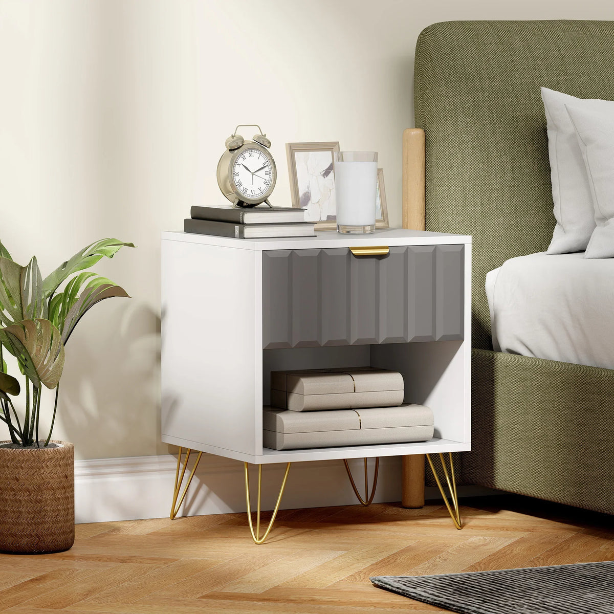 White bedside table with gray drawer front, open shelf, and gold legs