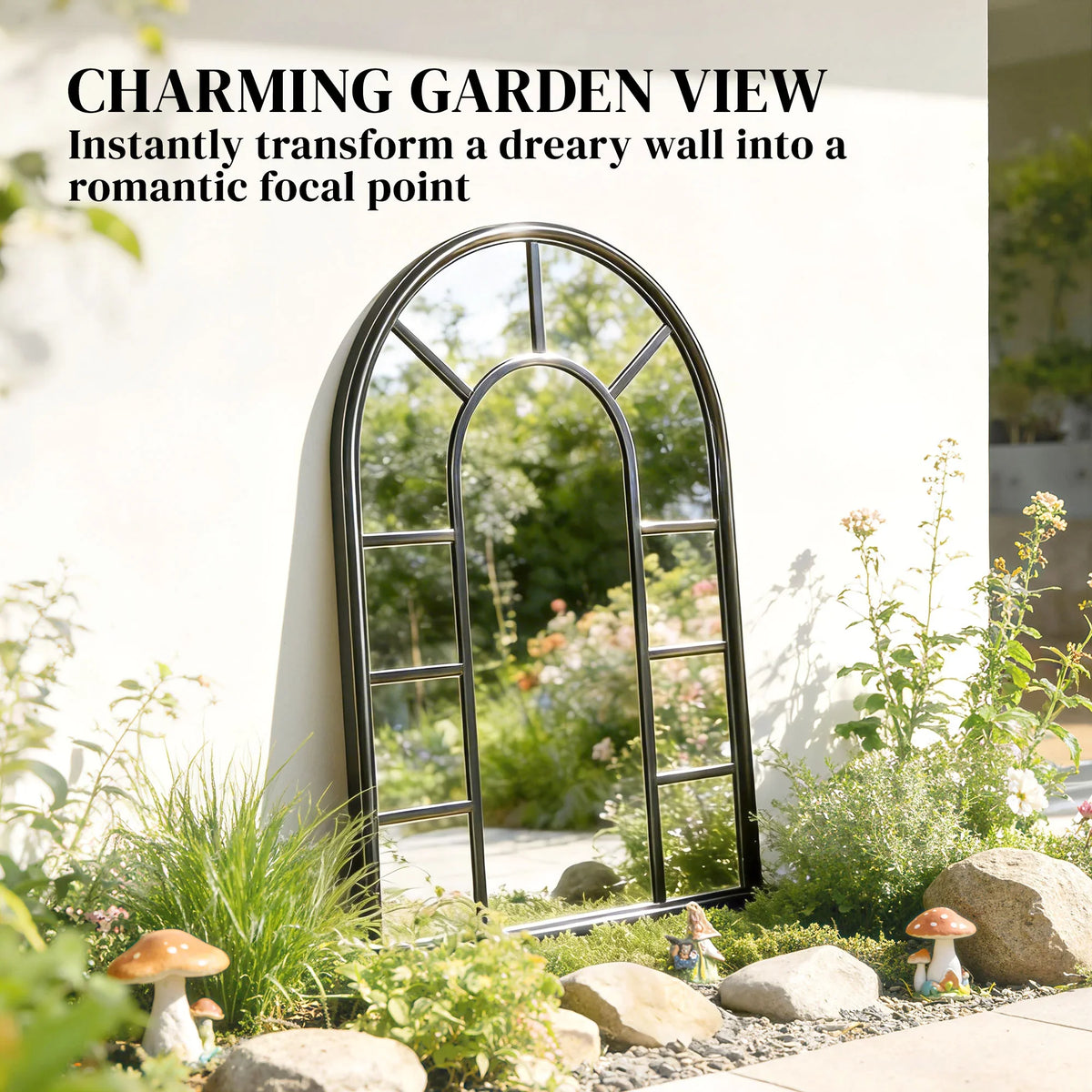 Black arched windowpane wall mirror reflecting garden view through curved frame