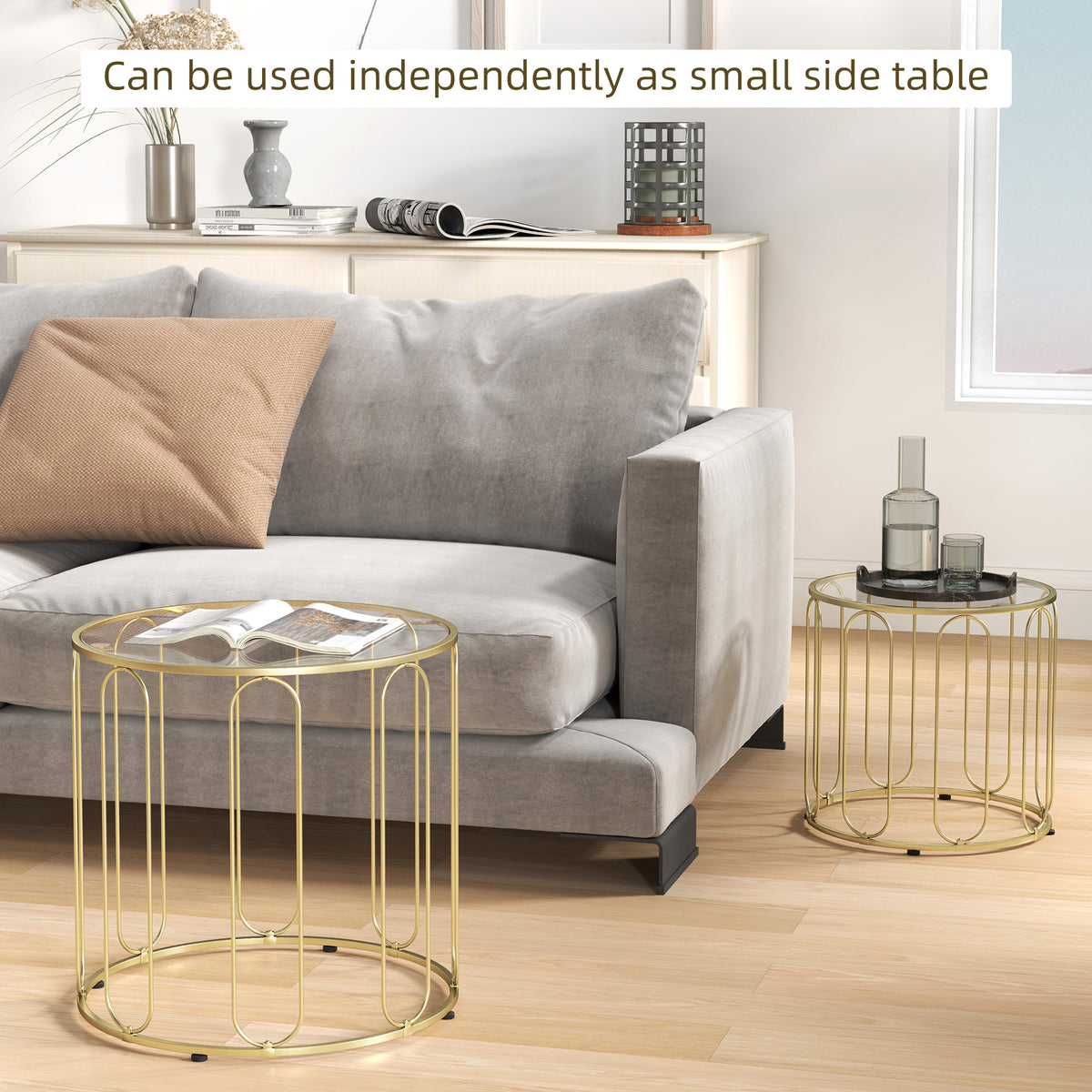 Gold-tone oval glass nesting tables with metal ring frame for a small side table