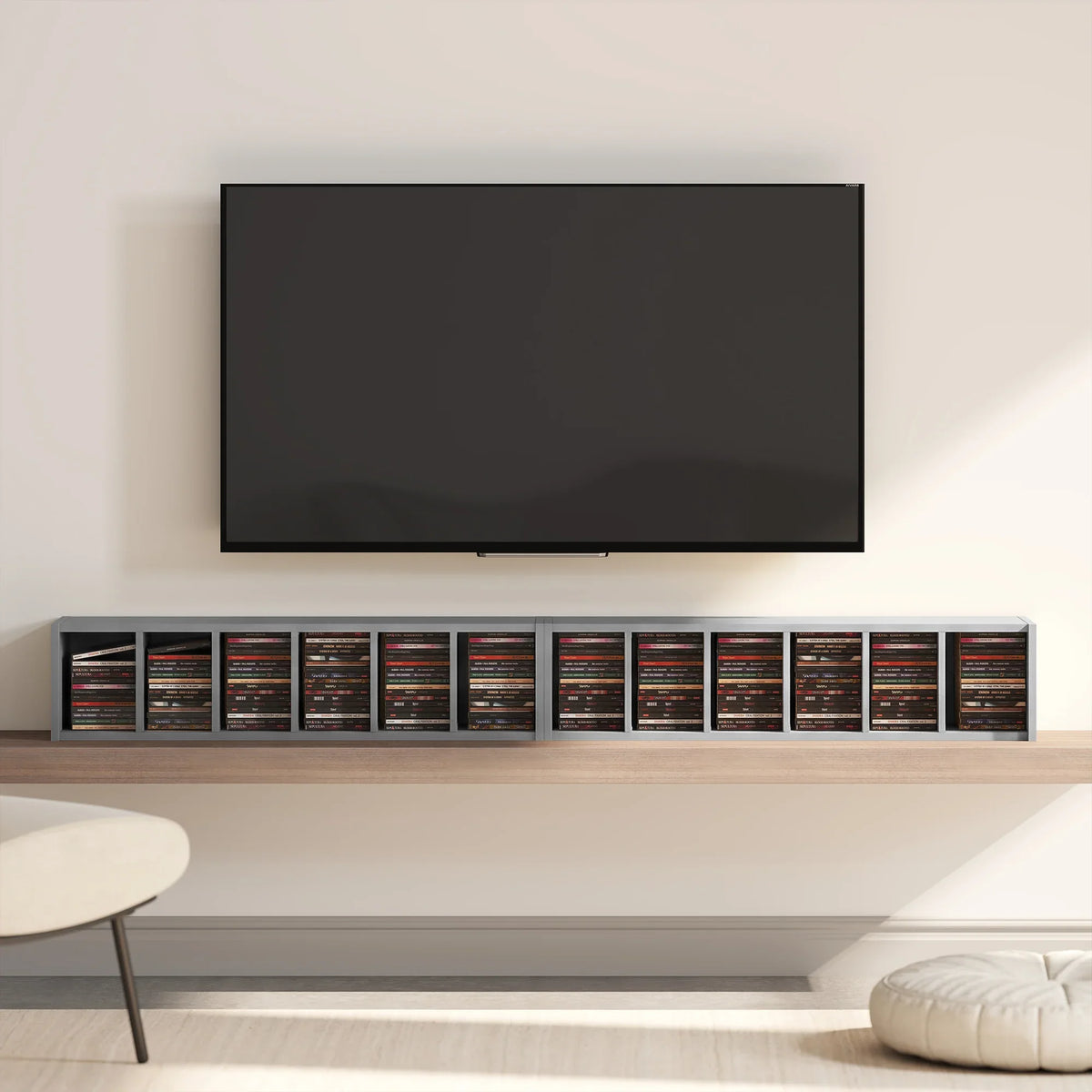 Light grey CD rack shelf with rows of CD cases under a TV