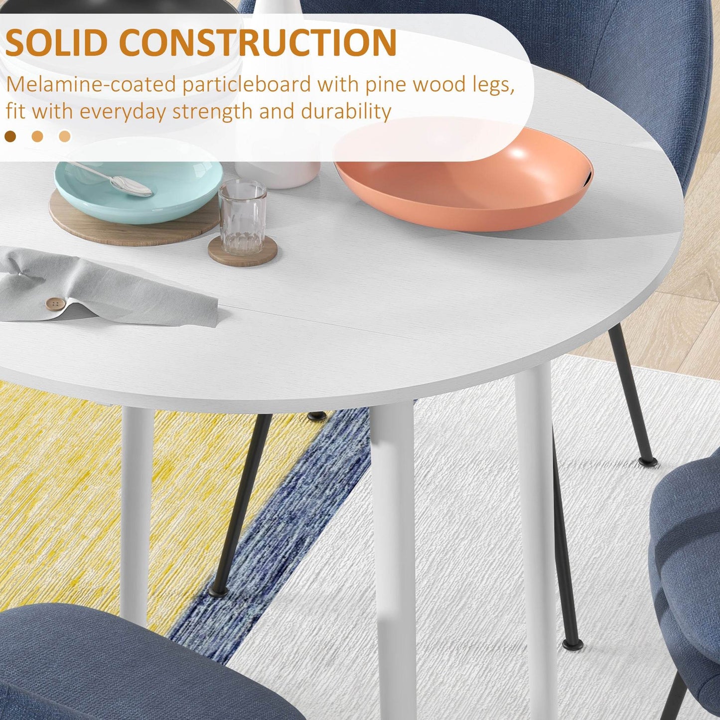 White round drop-leaf dining table with sturdy legs and underside detail