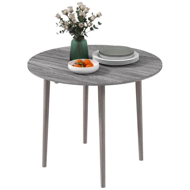 Grey round drop-leaf dining table with wood-grain tabletop and four legs