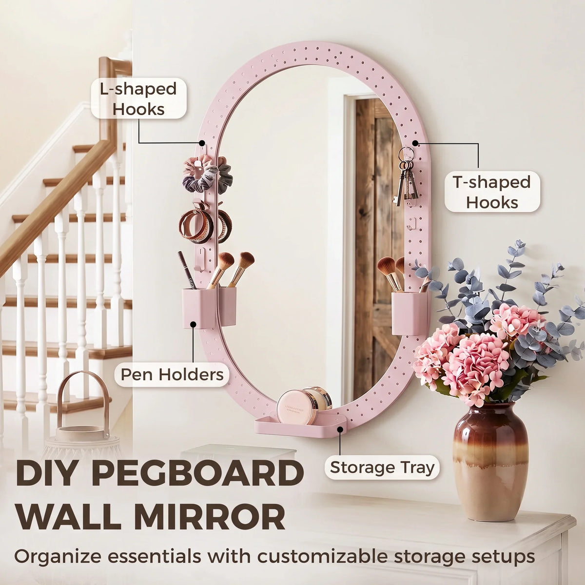 DIY pegboard wall mirror with pink oval frame, L- and T-shaped hooks, storage tray