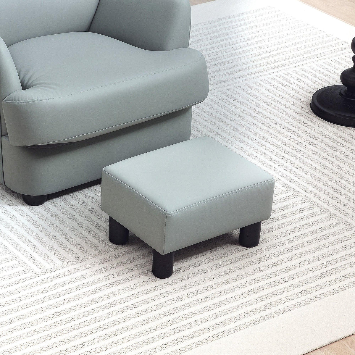 Gray PU leather footstool with padded top and four plastic legs, square cushion