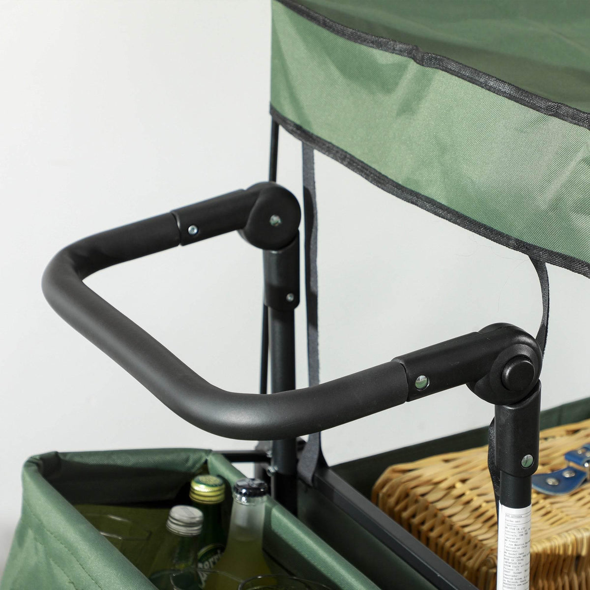 Green beach trolley cart handle with black padded grips and locking hardware