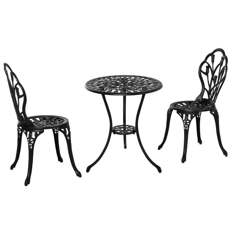 Black round bistro table with two arched-back chairs, perforated floral lattice design
