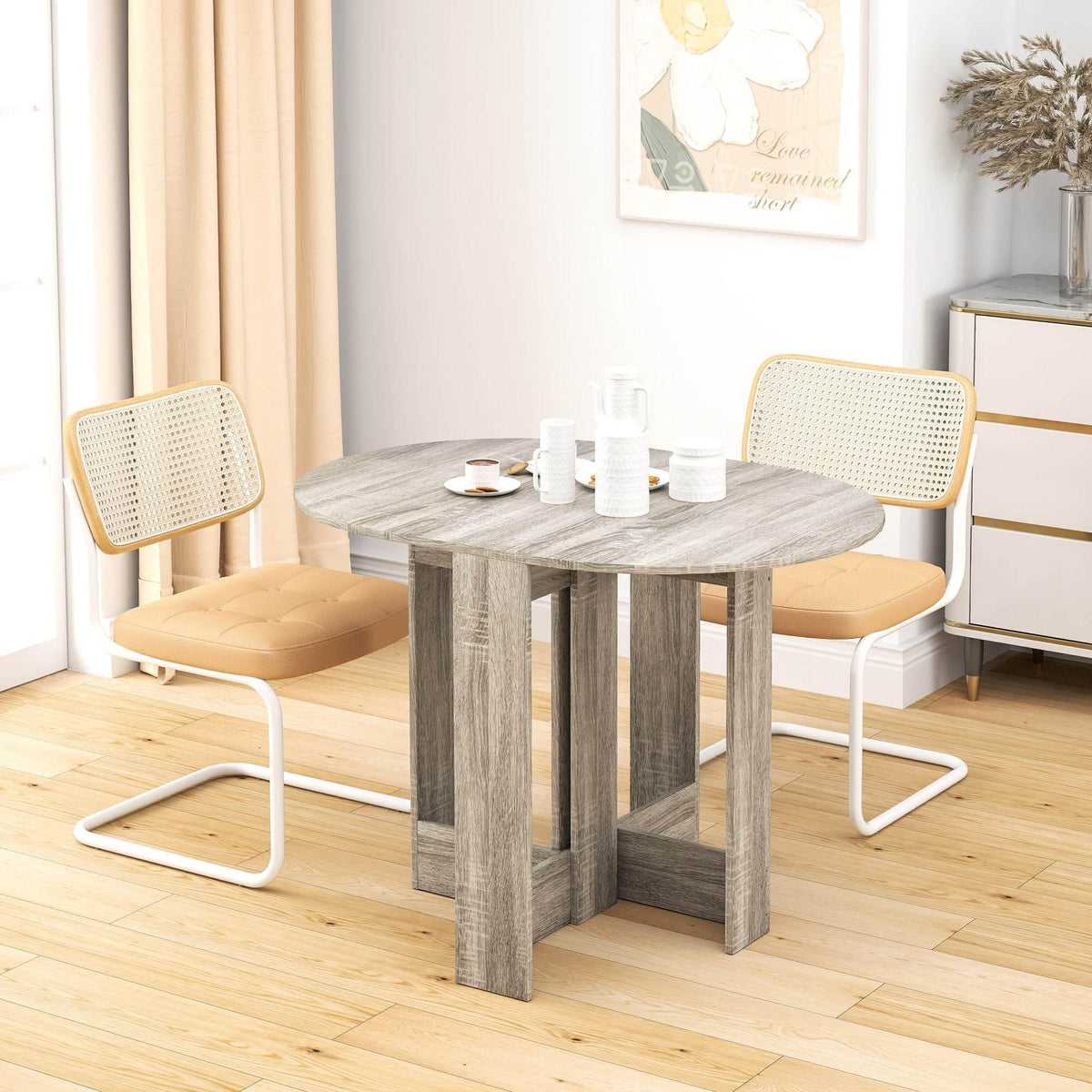 Grey folding drop-leaf dining table with round tabletop and cross-leg base