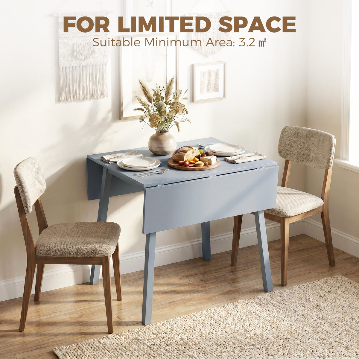 Gray drop-leaf folding dining table for small spaces, with two chairs
