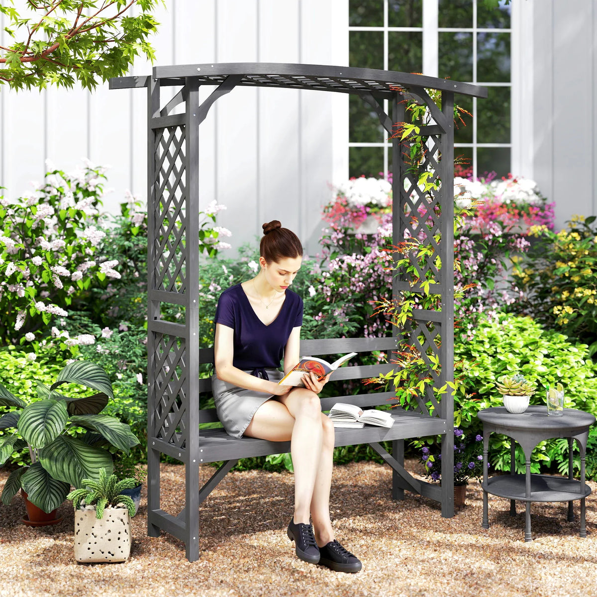 Grey wooden garden arbour bench with trellis frame, two-seat bench, and lattice sides.
