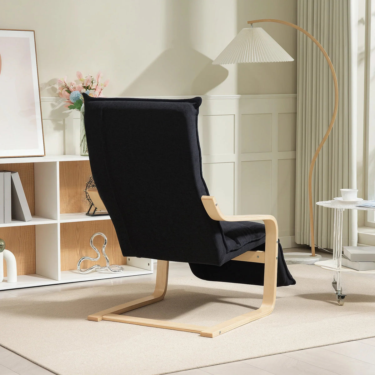 Black velvet accent rocking chair with curved birch frame and supportive headrest