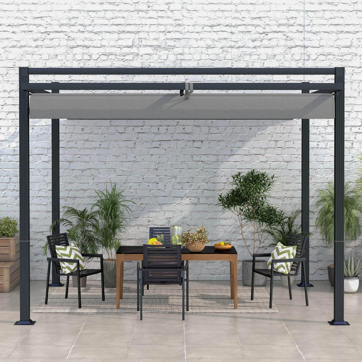 Dark grey retractable pergola with gray canopy over patio seating in a courtyard