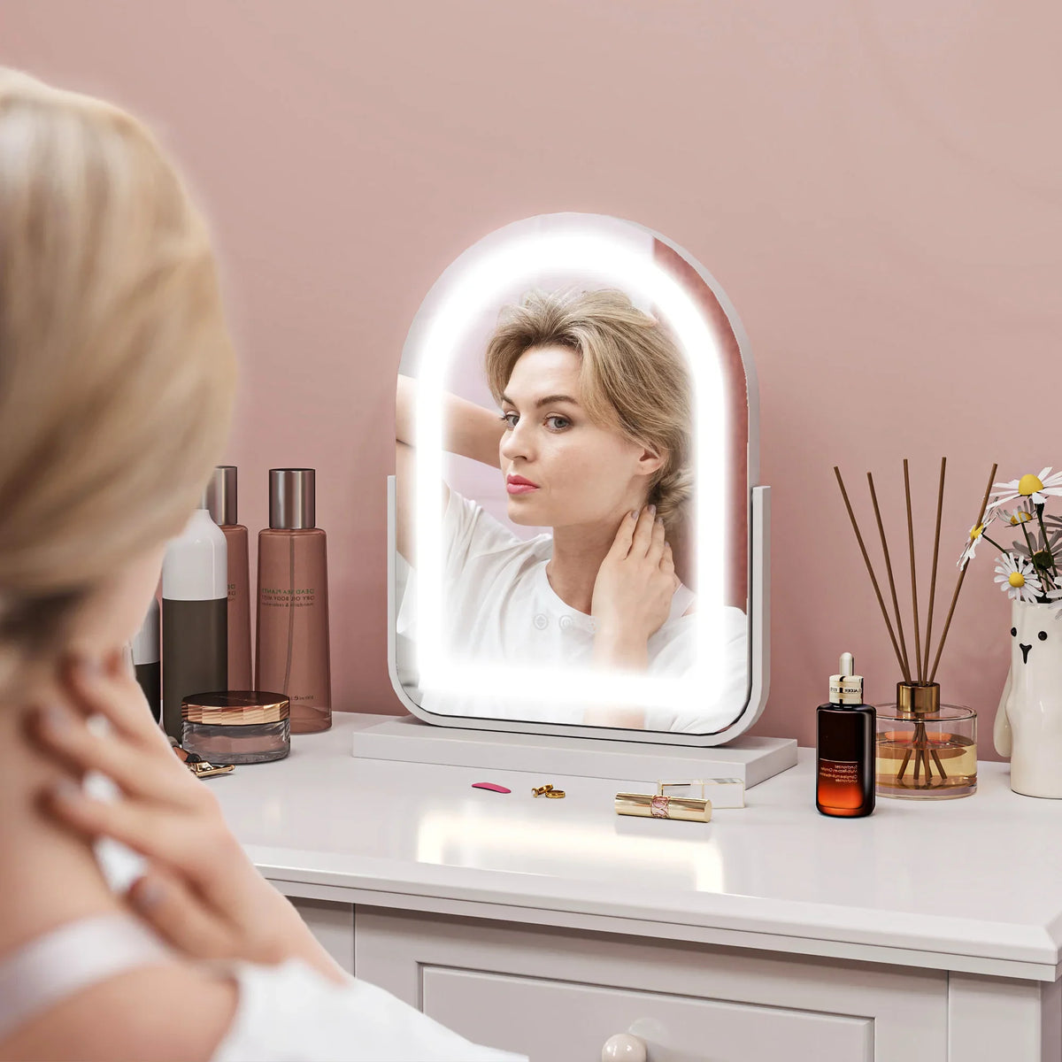 White LED vanity mirror with arched frame, integrated ring light, adjustable base