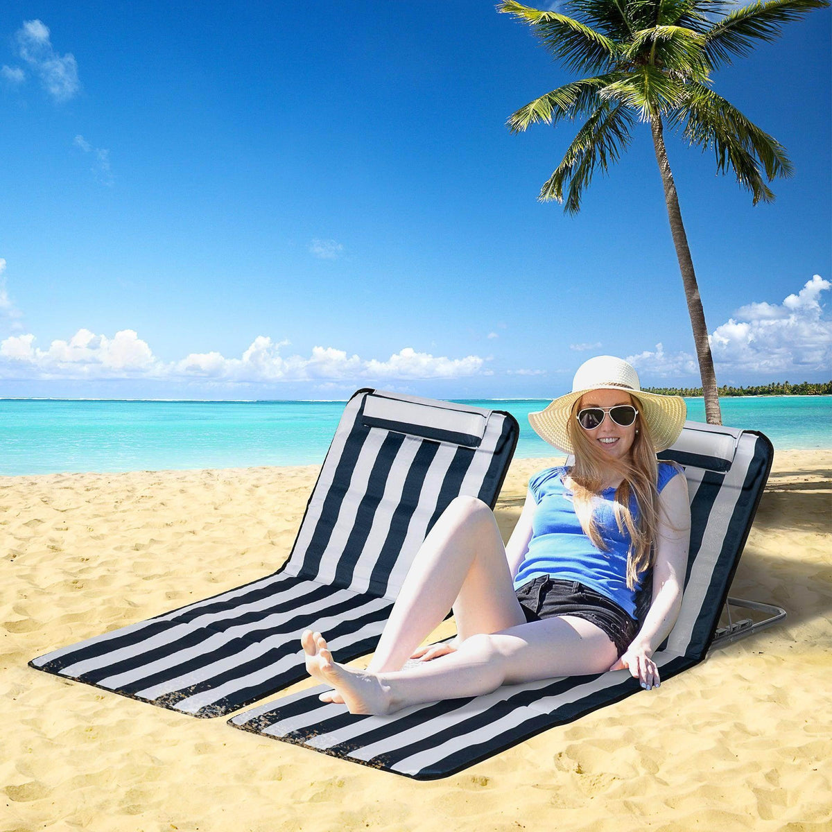 Foldable lounge beach chair with navy and white striped fabric, open reclined position