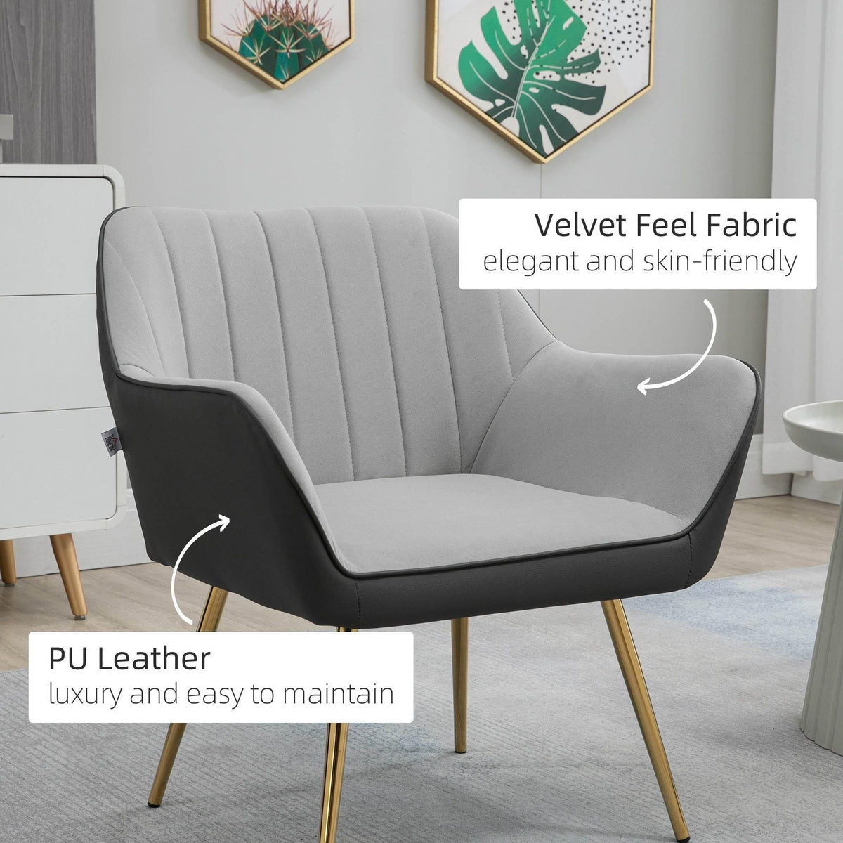 Light grey upholstered accent armchair with curved arms and gold-finished legs