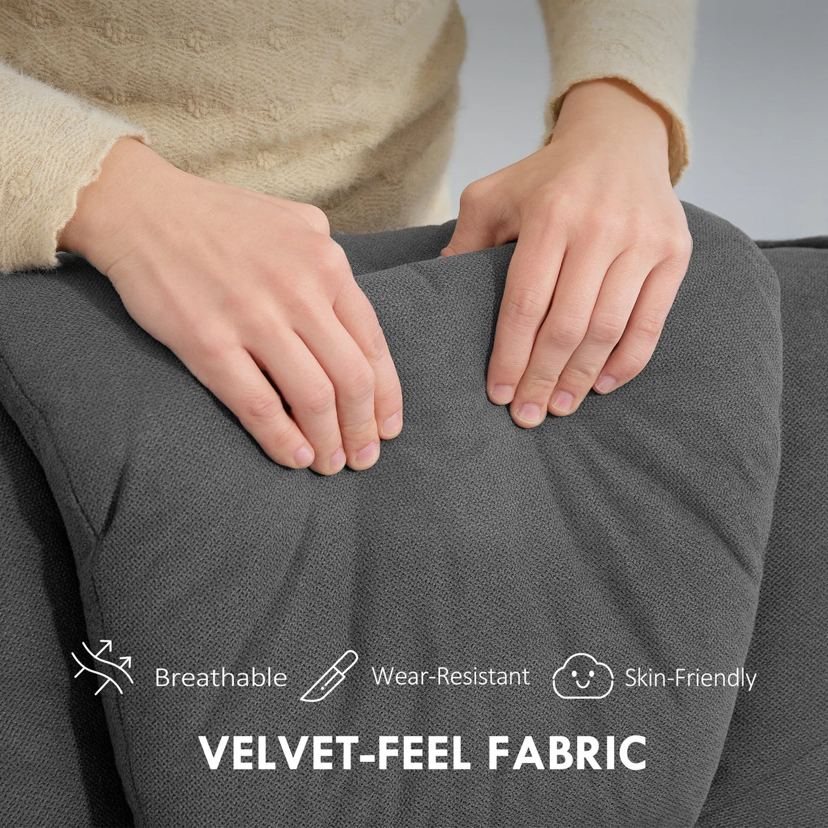 Close-up of charcoal grey velvet recliner chair fabric texture