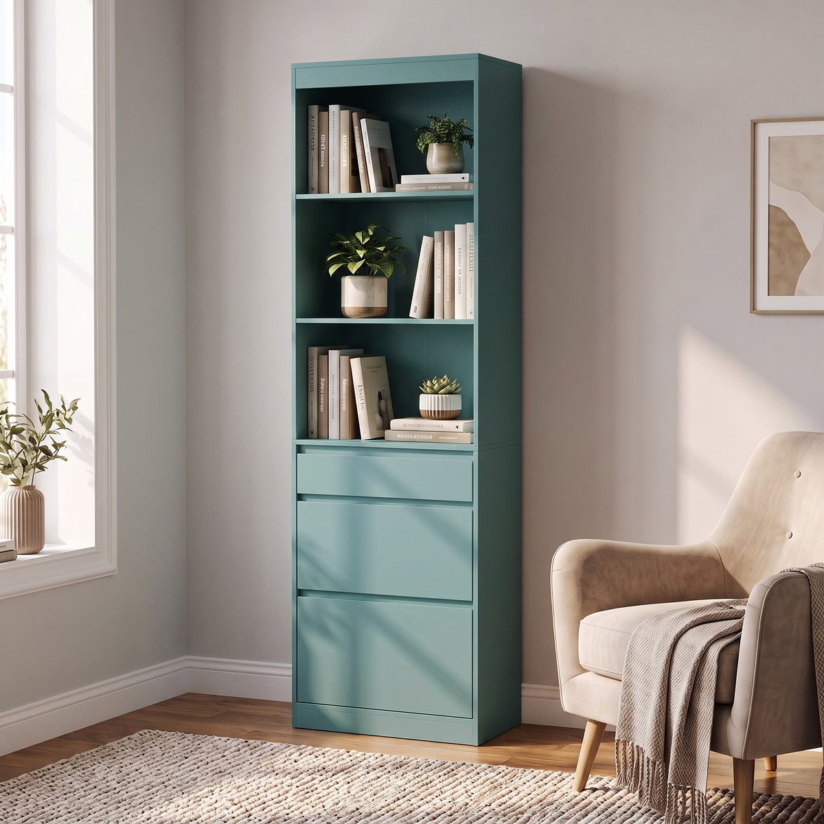 Light green narrow bookcase with open shelves and three drawers, shown at an angle