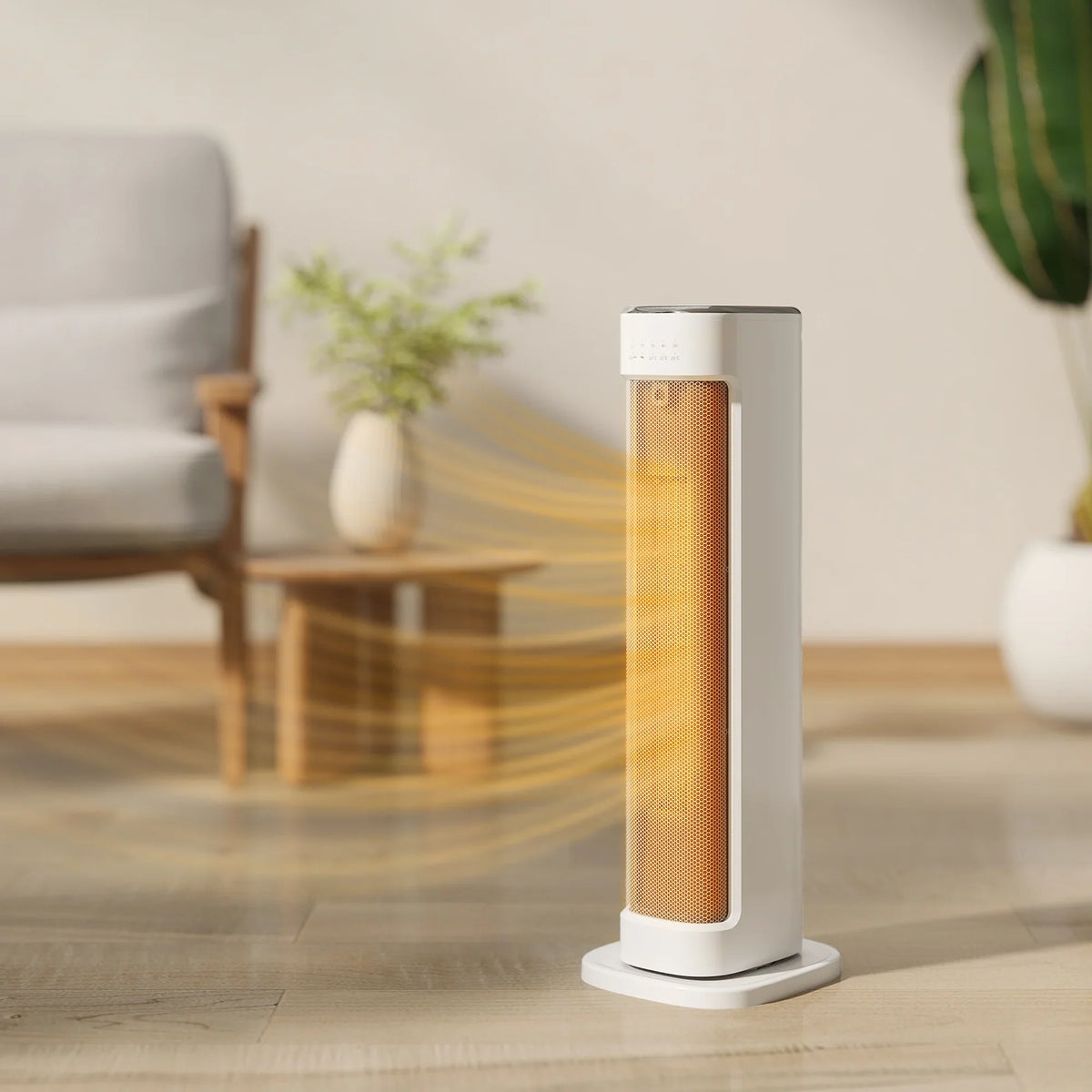 White ceramic tower heater with glowing heating element in front of a chair and plant