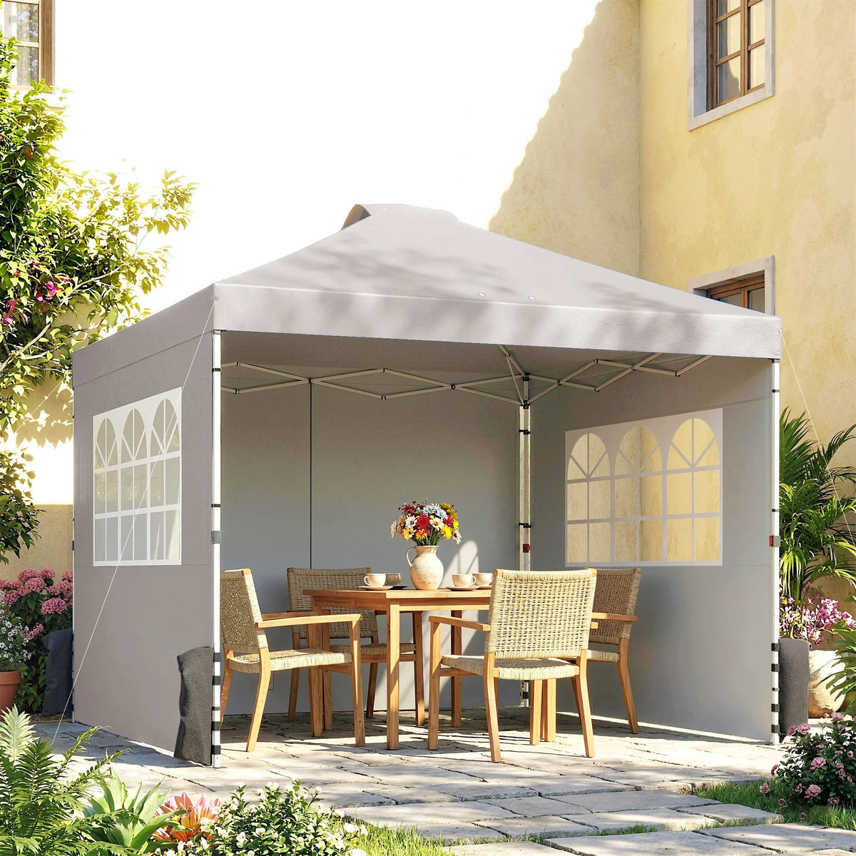 Grey 3x3m pop-up gazebo with waterproof canopy and open side panels for outdoor seating