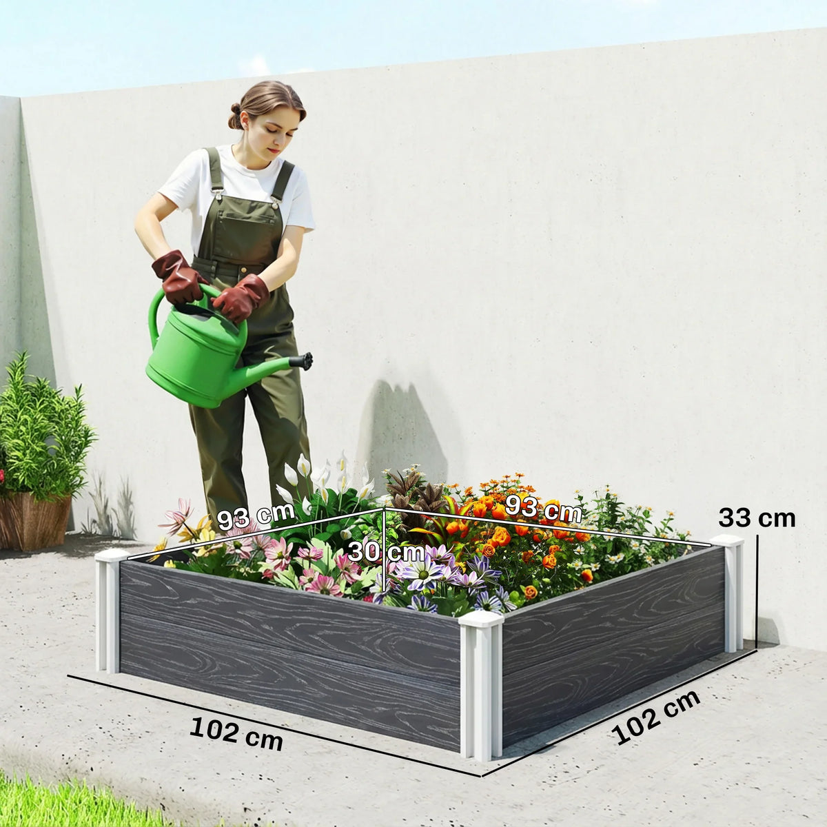 Dark grey modular vinyl raised garden bed with white slotting legs and open top
