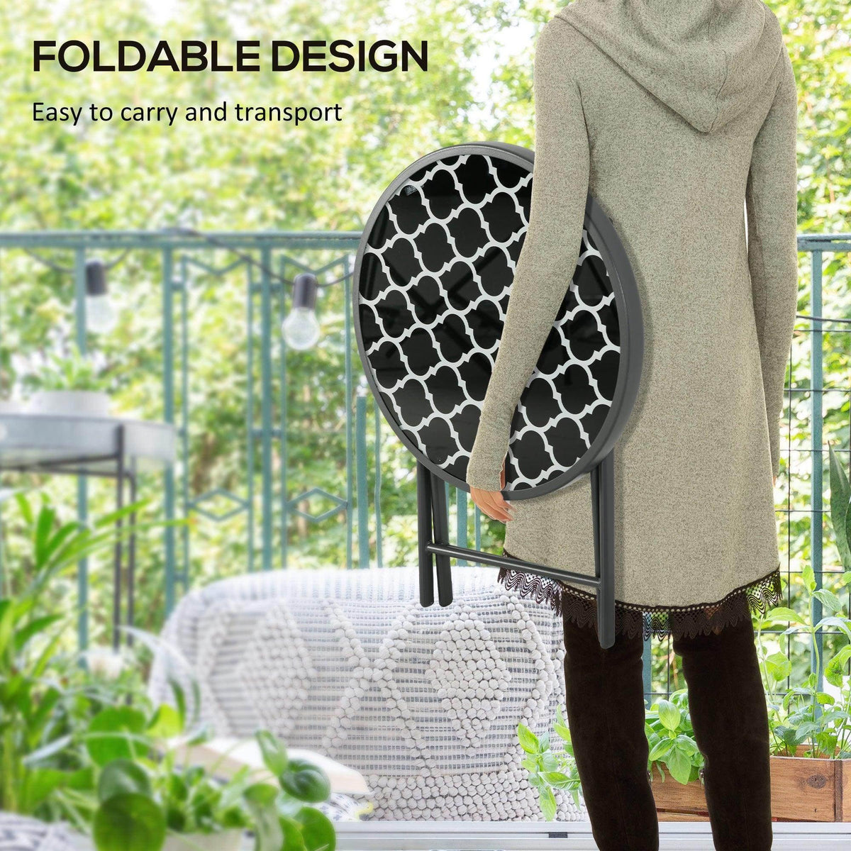 Black round folding side table with patterned glass top and sturdy tripod legs