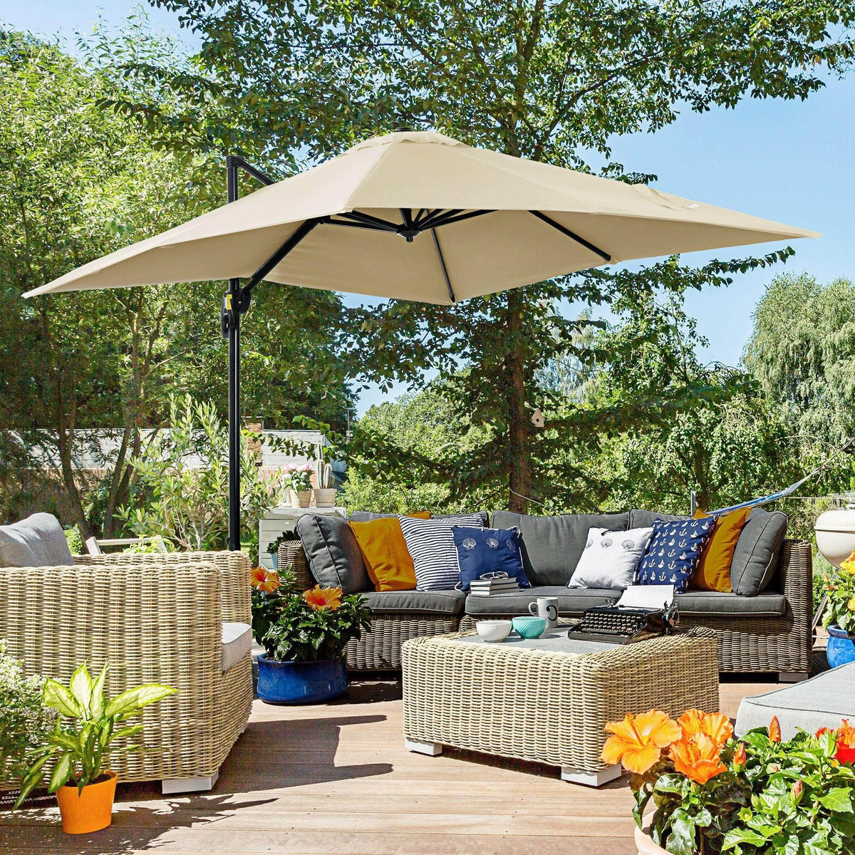 Cream white square cantilever patio umbrella with open canopy and central crank pole