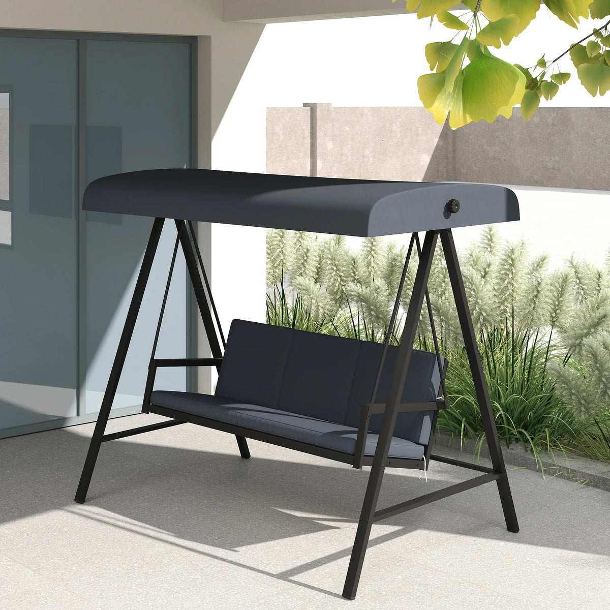 Dark gray outdoor three-seat swing bench with canopy and padded seat cushions