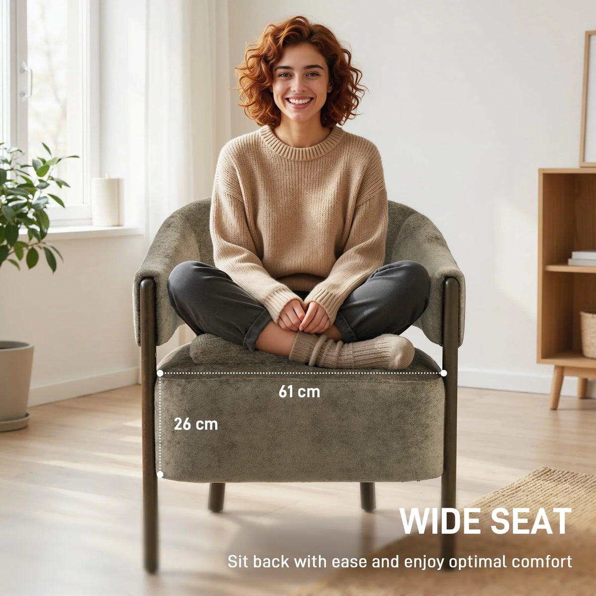 Light brown tub chair with wide seat, rounded arms, and solid wood legs