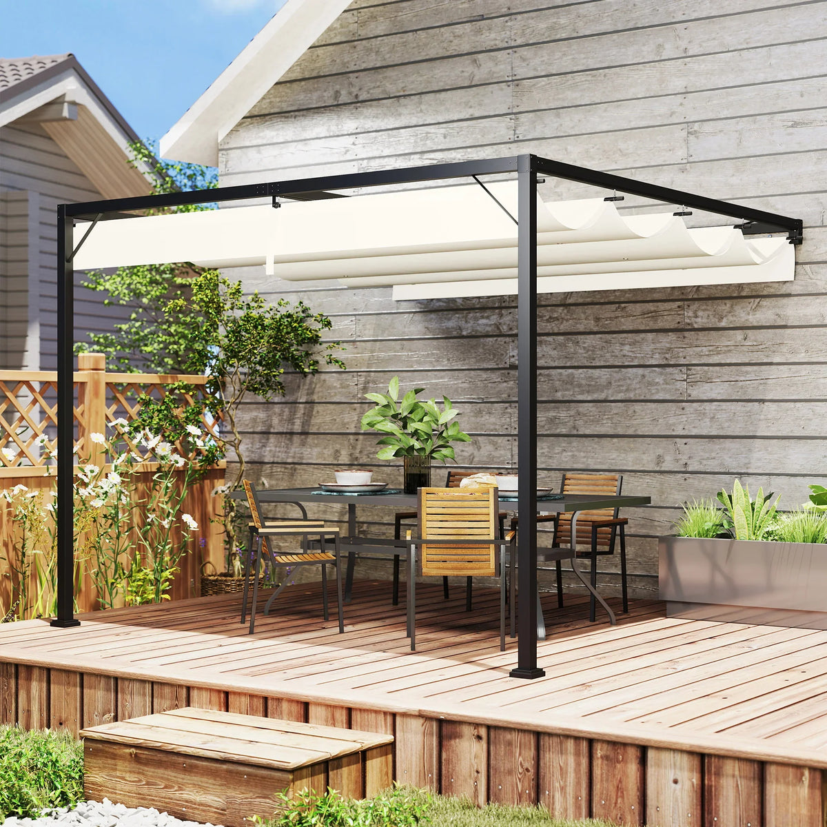 Cream retractable canopy outdoor gazebo with black posts over wooden deck dining setup