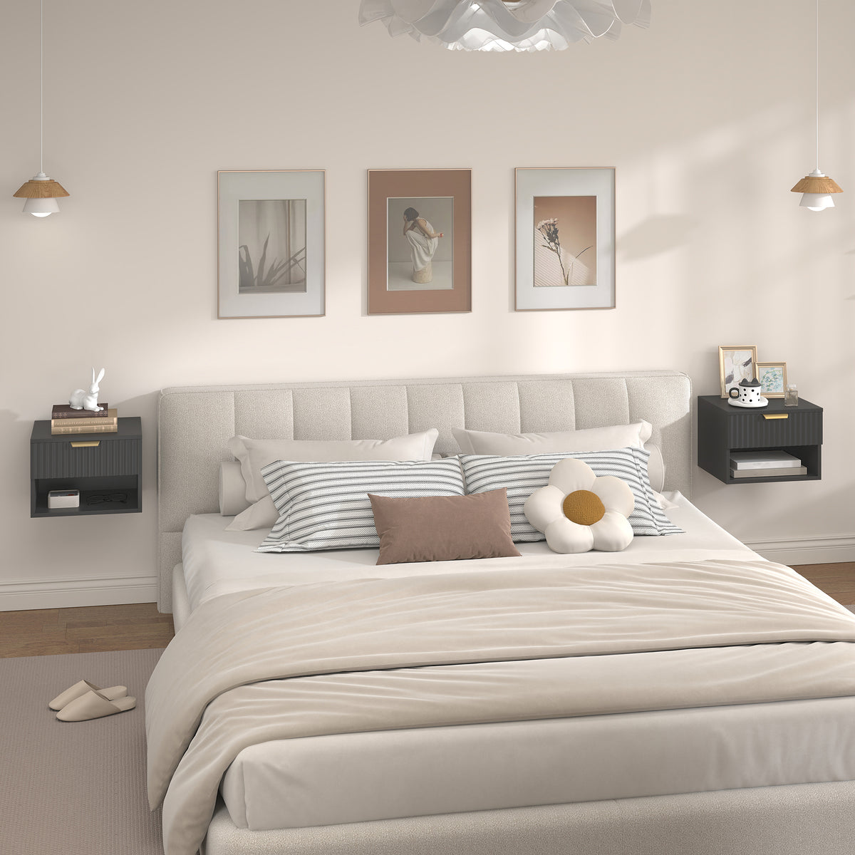 Black floating bedside table pair with gold handle bars on both sides of the bed.