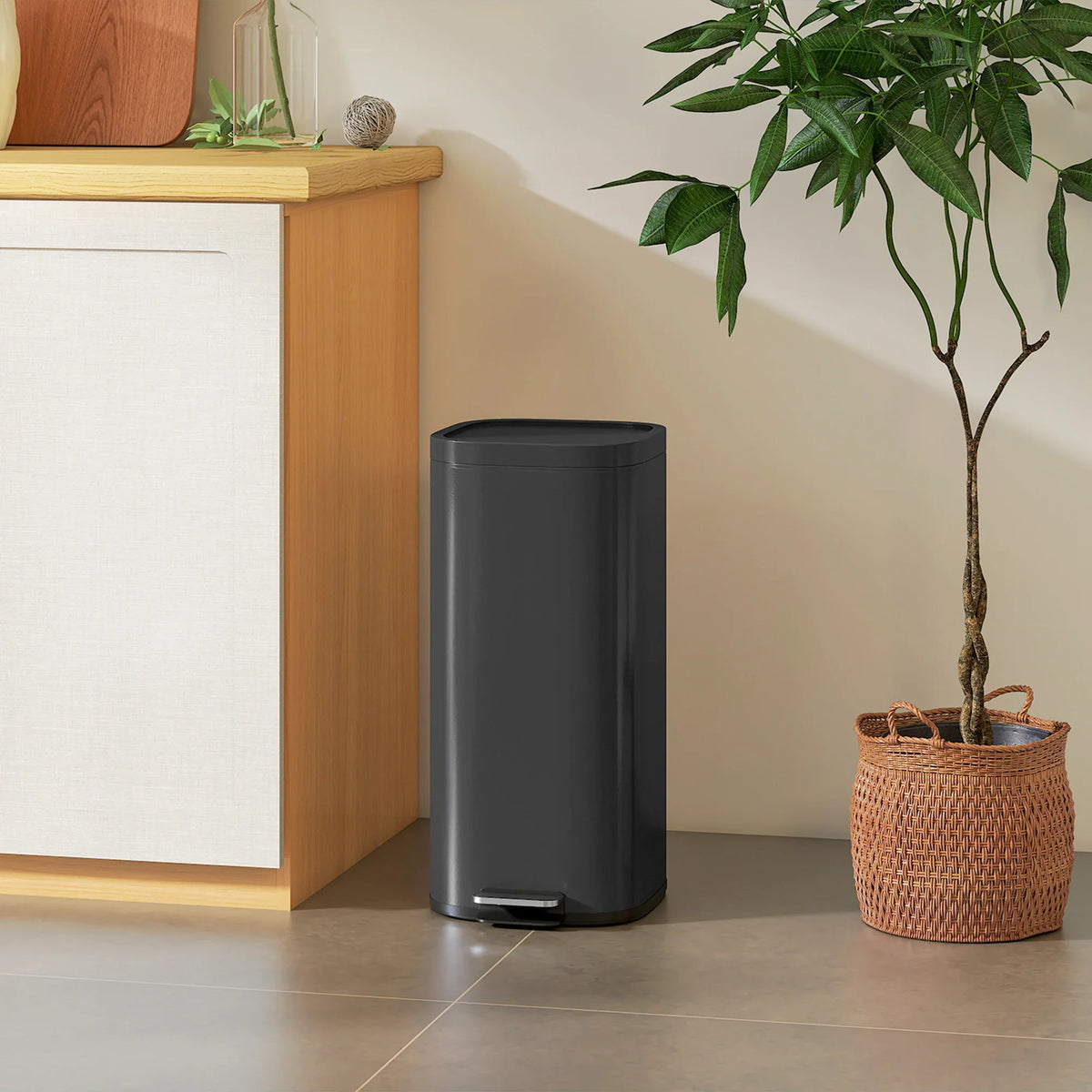 Black 30L compact trash can with pedal and narrow round profile