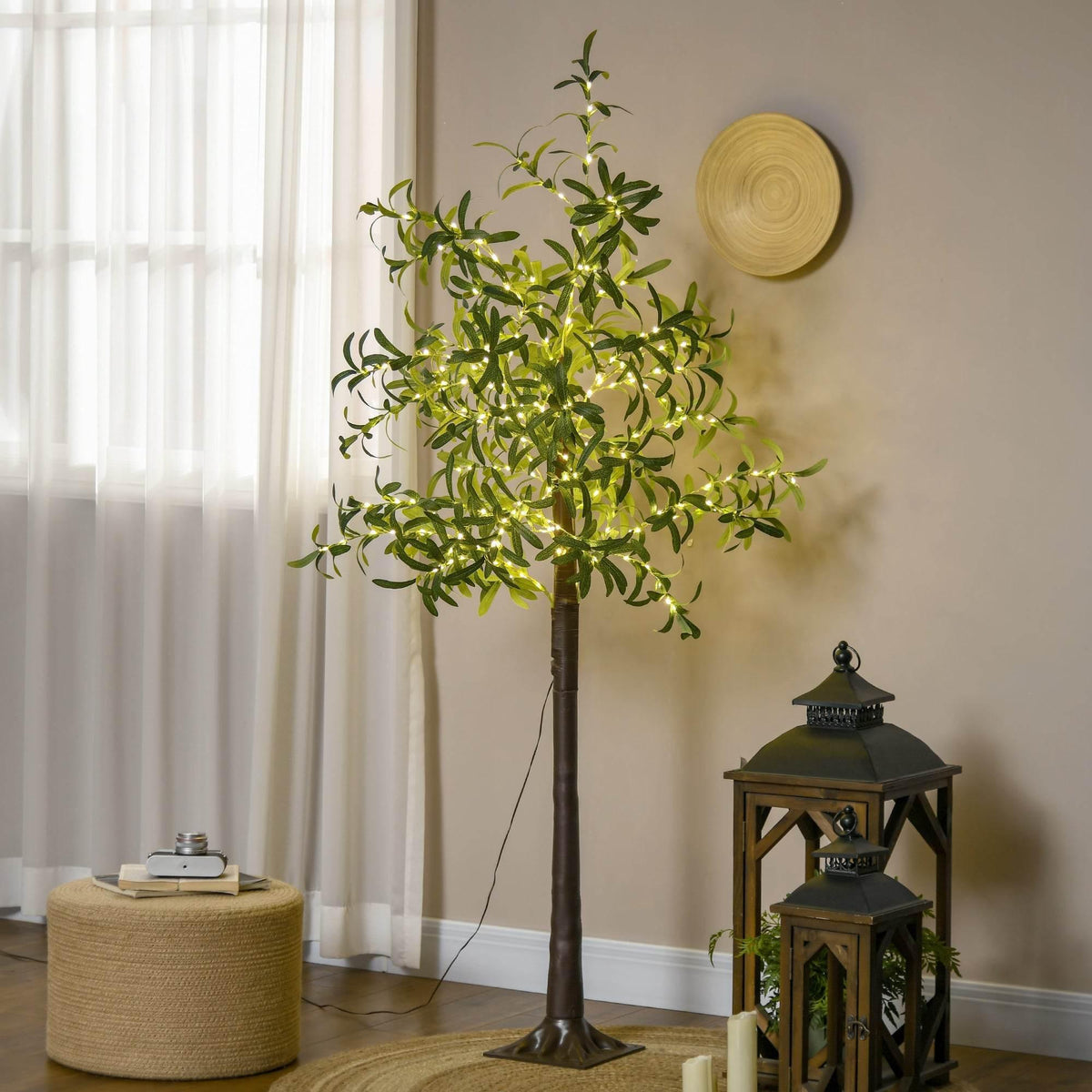 Prelit olive tree with warm white LED lights, green leaves on a brown base