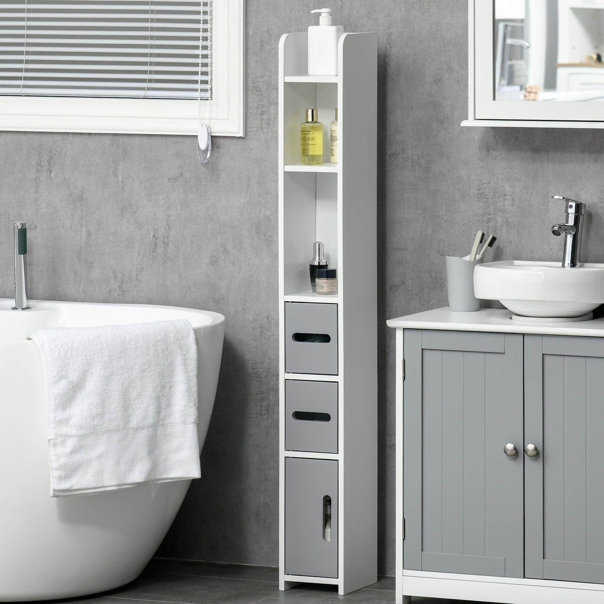 Grey tall bathroom storage cabinet with three pull-out drawers and door cupboards beside vanity