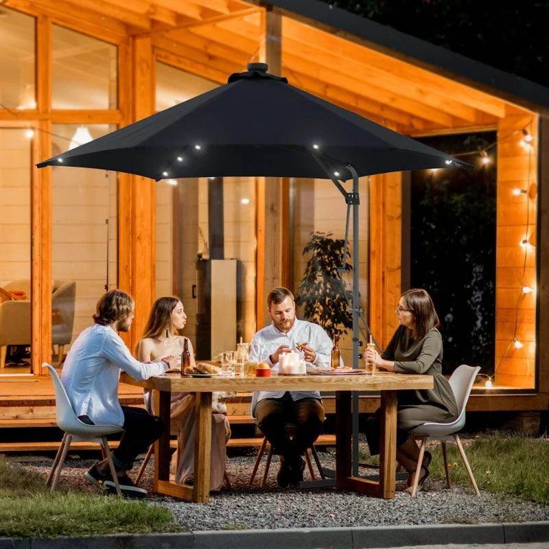 Black cantilever patio umbrella with solar LED lights over a seating table